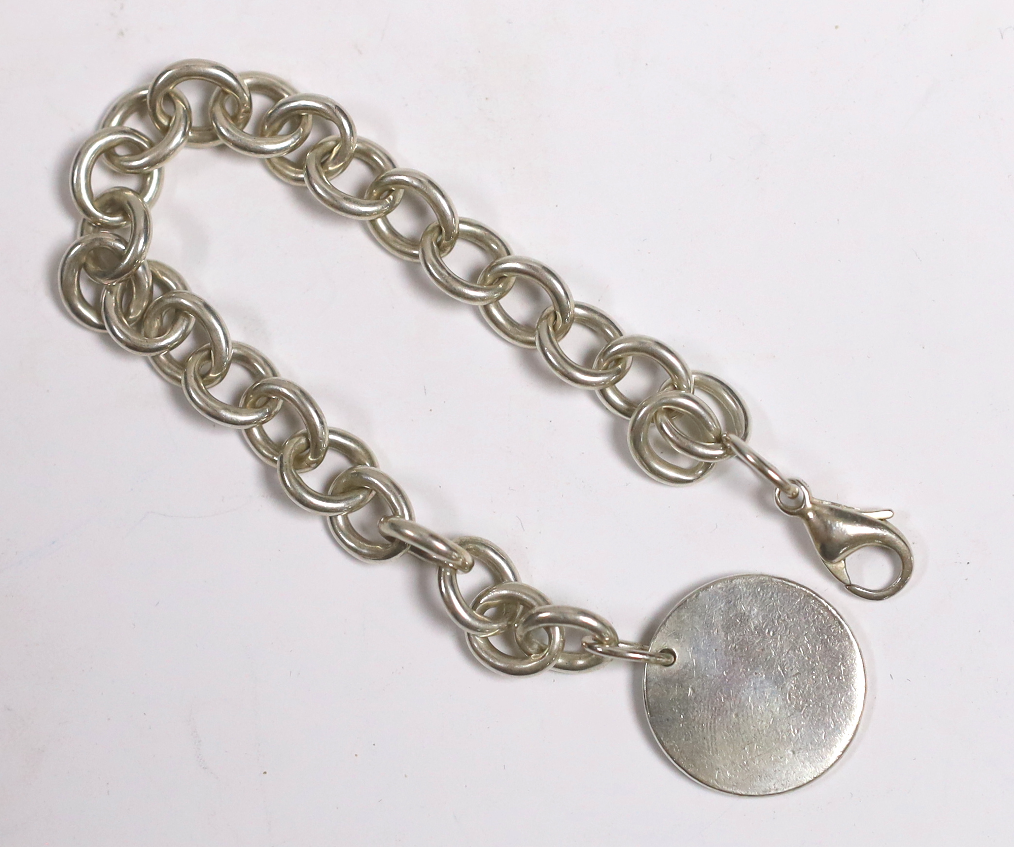 A Tiffany & Co sterling circular link bracelet with tag, 20cm excluding tag, with Tiffany pouch and box.